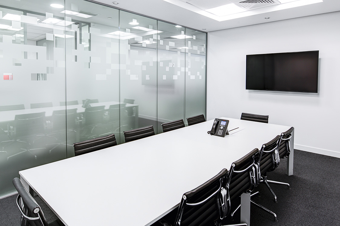 Meeting room with frosted glass and white walls